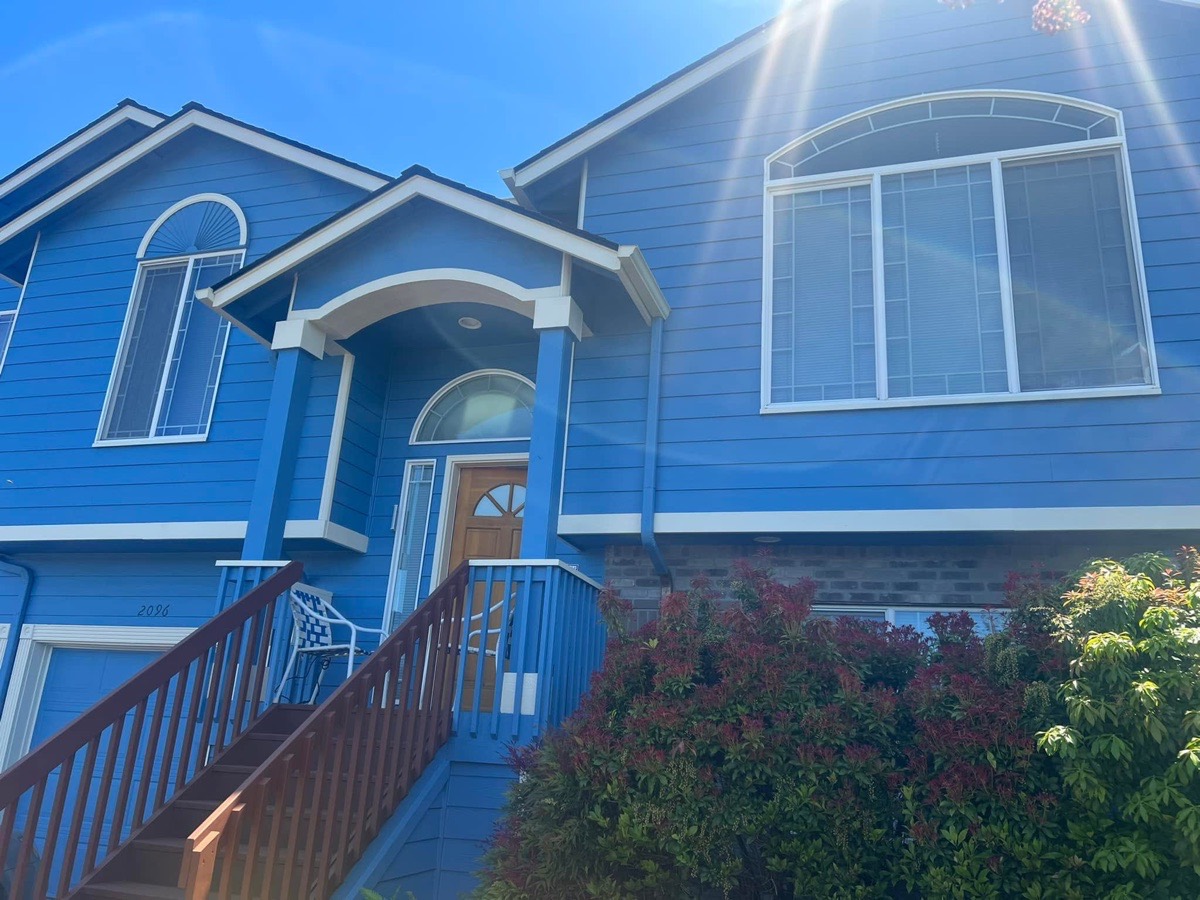 Blue exterior house painting project